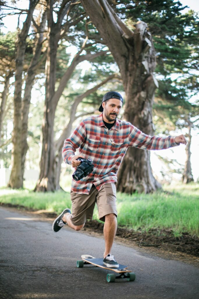 A man skateboards across the pavement